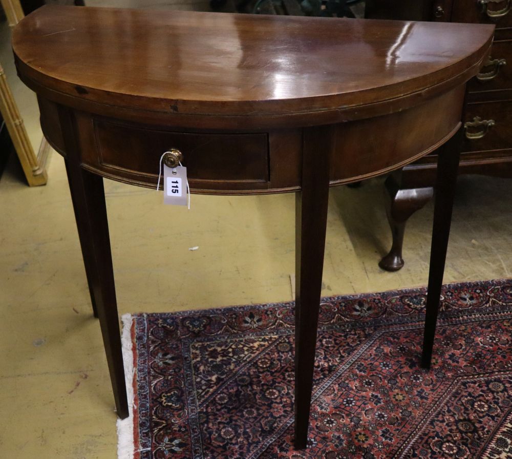 A George III style mahogany demi lune card table, width 86cm, depth 43cm, height 76cm